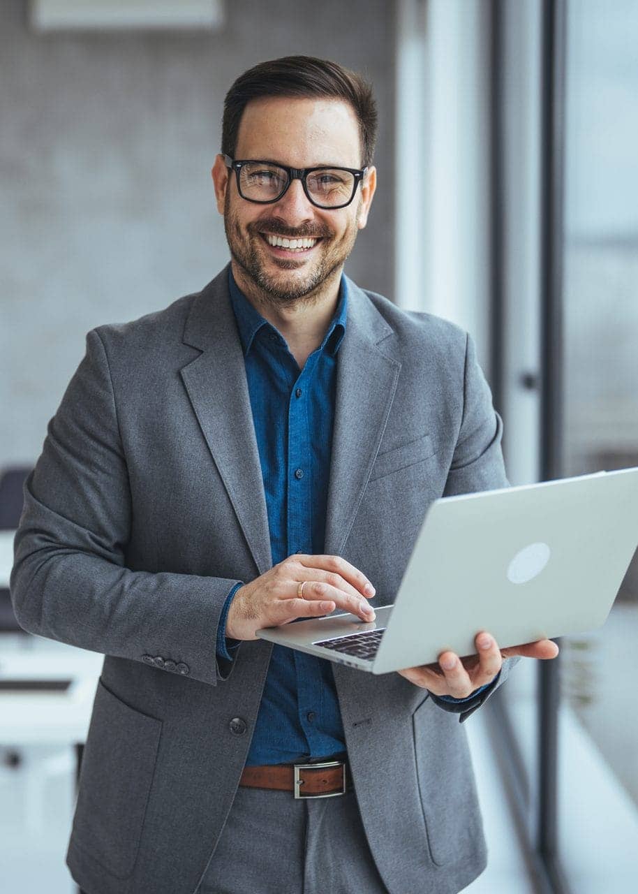 Business professional working on a laptop in a modern office